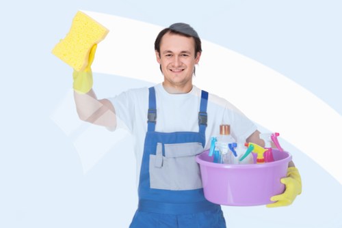 Technician treating pet stain and odour contamination in an Ealing home